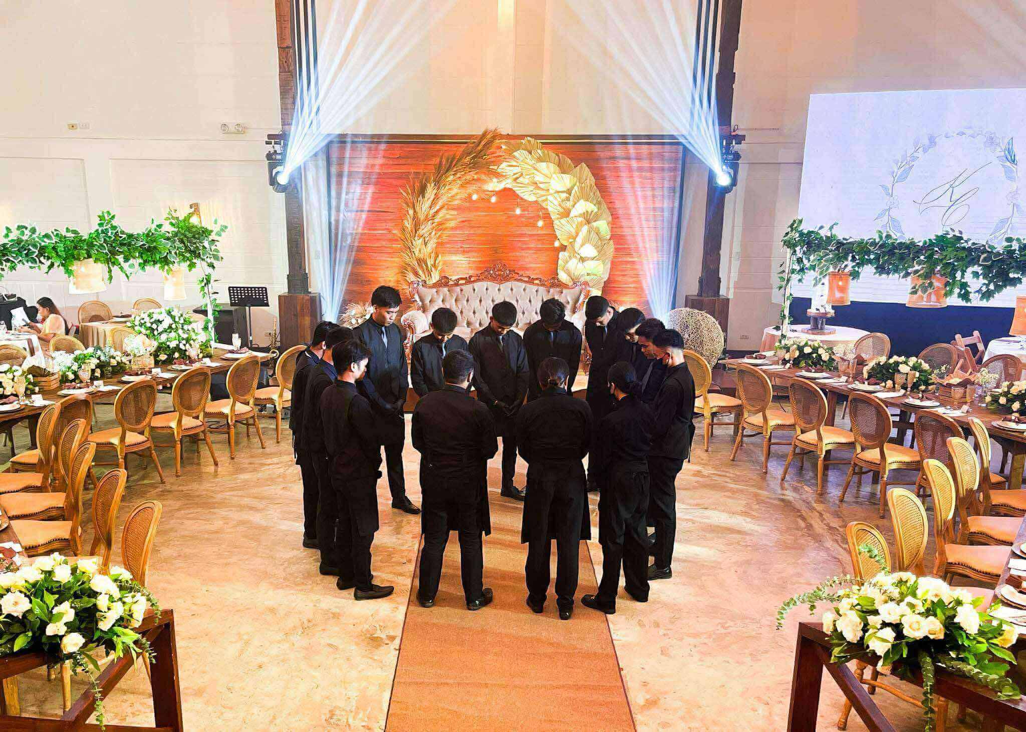 Manang A wedding staff huddle